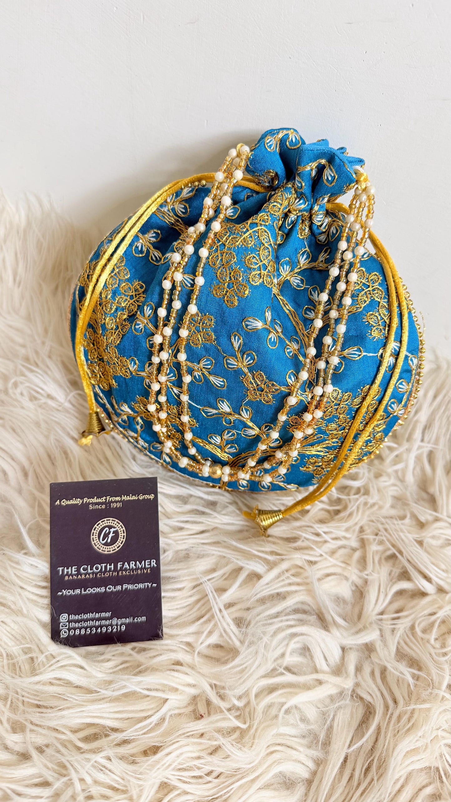 BLUE COLOR EMBROIDED BANARASI POTLI