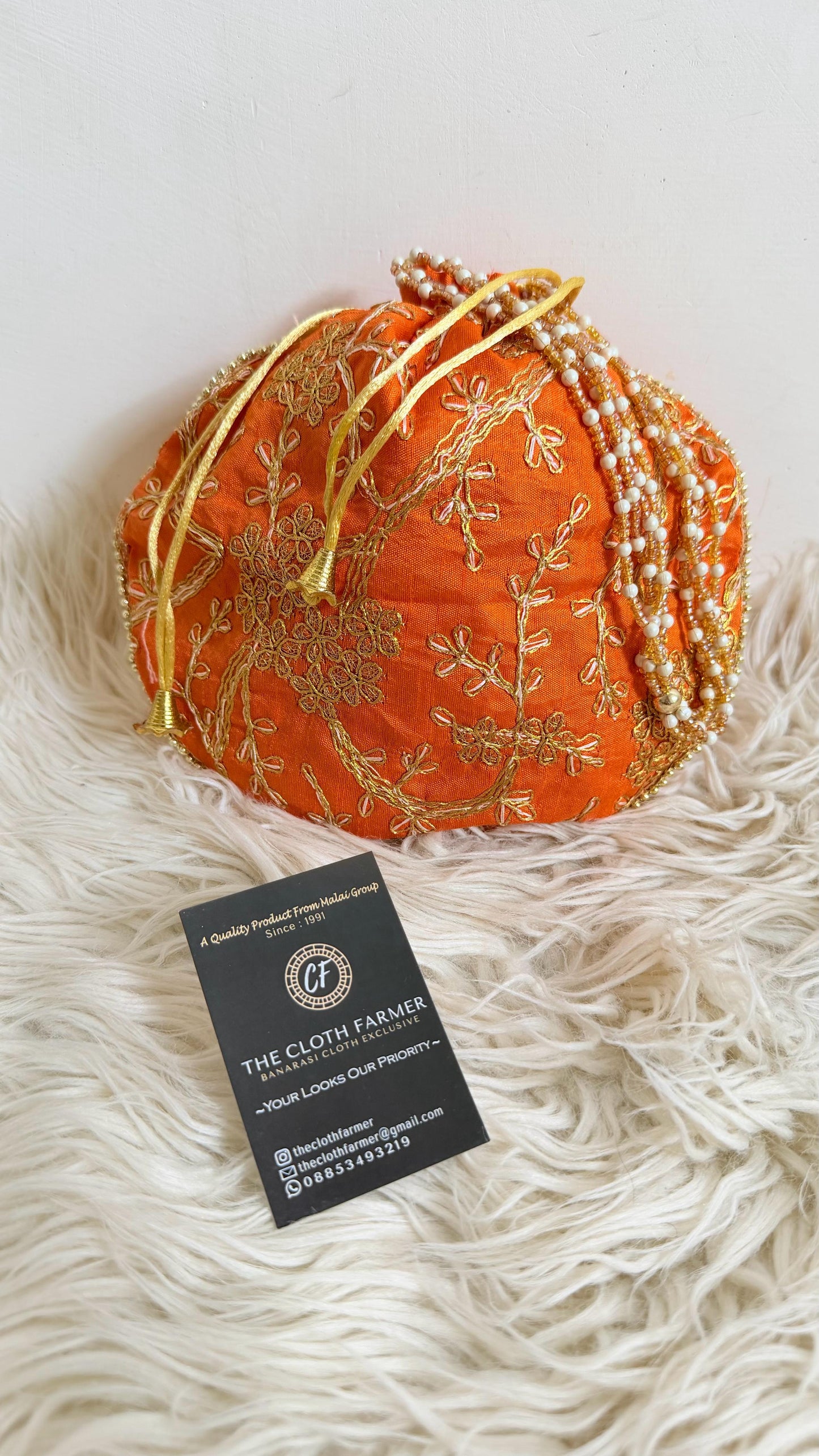 ORANGE COLOR BANARASI EMBROIDED POTLI