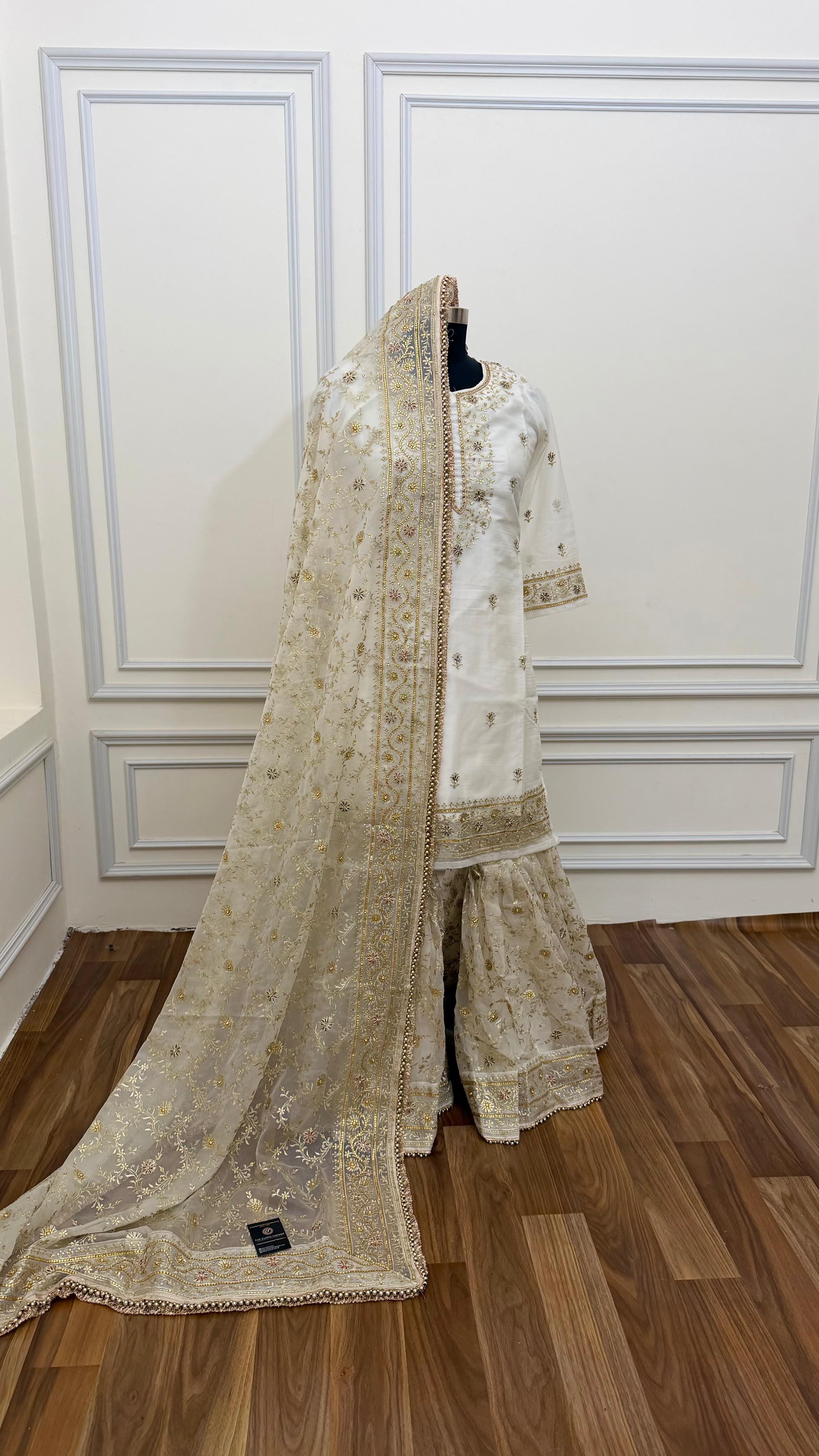OFF WHITE EMBROERDED GHARARA WITH HAND WORK TOUCH