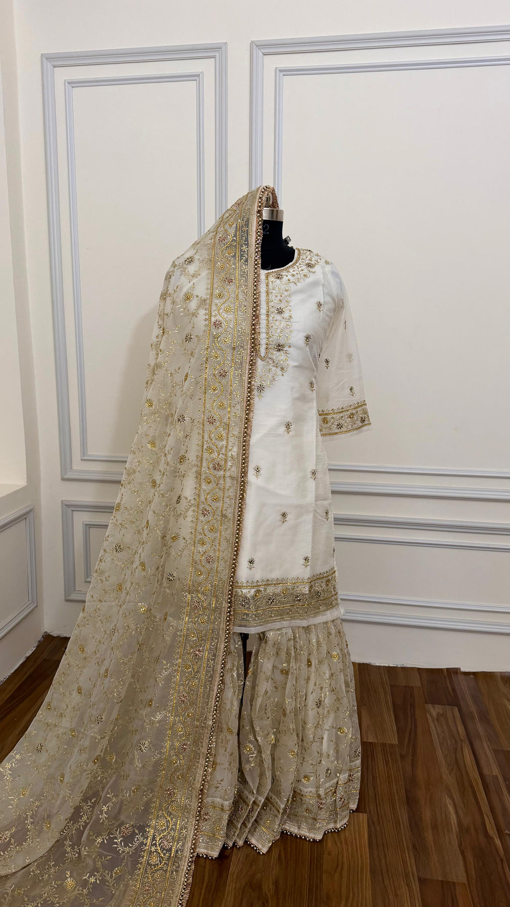 OFF WHITE EMBROERDED GHARARA WITH HAND WORK TOUCH