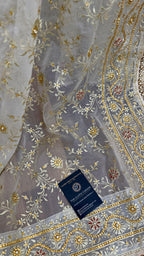 OFF WHITE EMBROERDED GHARARA WITH HAND WORK TOUCH