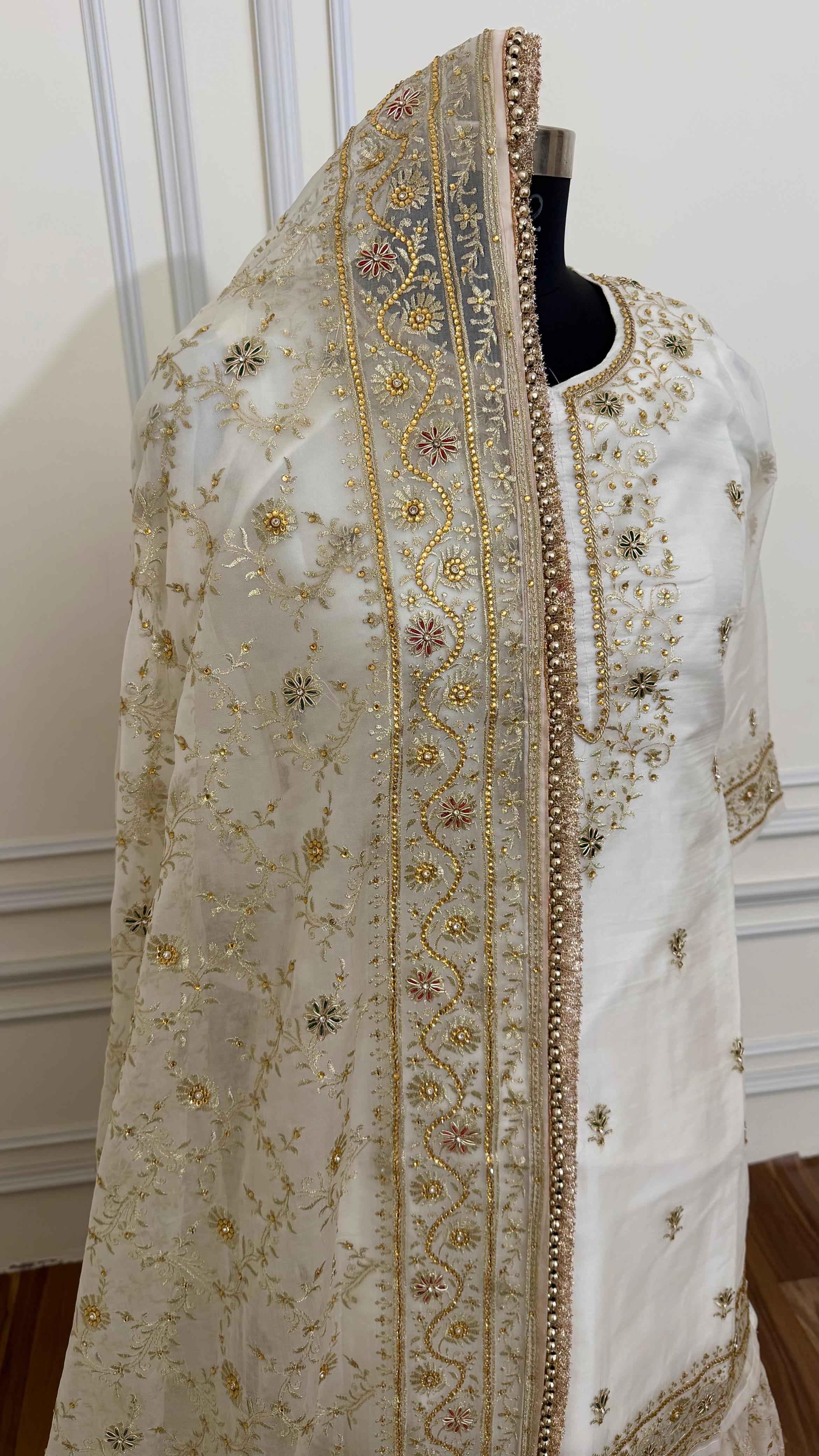 OFF WHITE EMBROERDED GHARARA WITH HAND WORK TOUCH