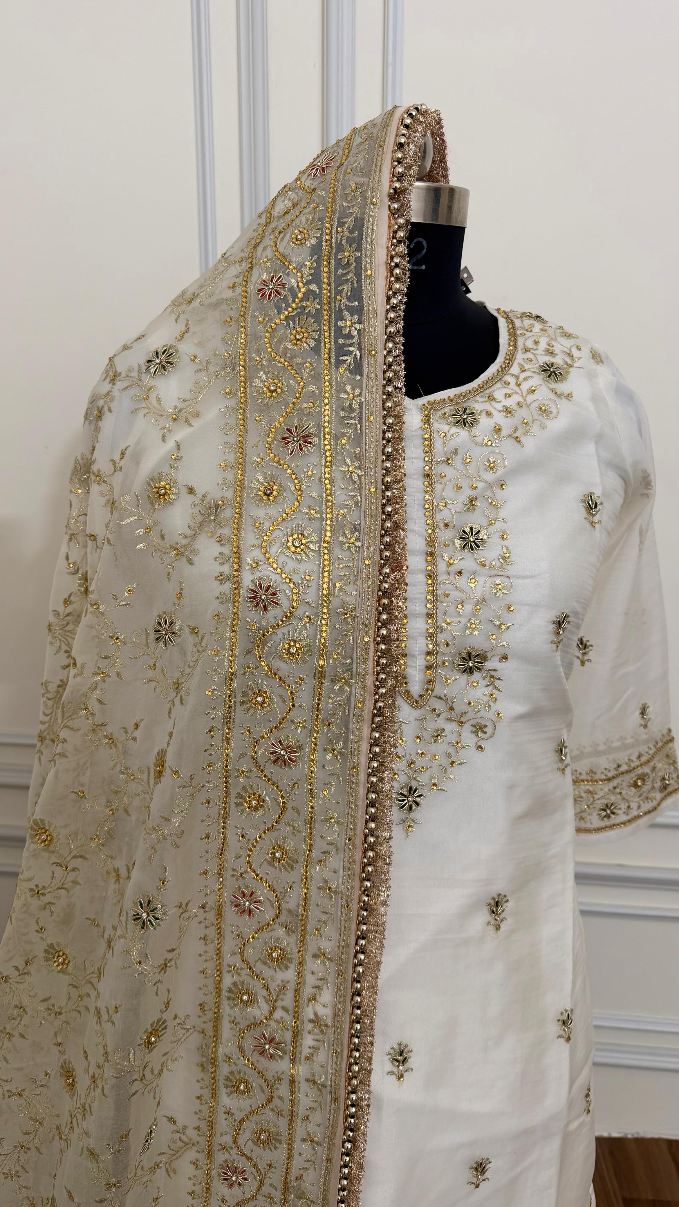 OFF WHITE EMBROERDED GHARARA WITH HAND WORK TOUCH