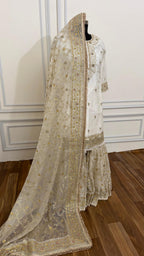 OFF WHITE EMBROERDED GHARARA WITH HAND WORK TOUCH
