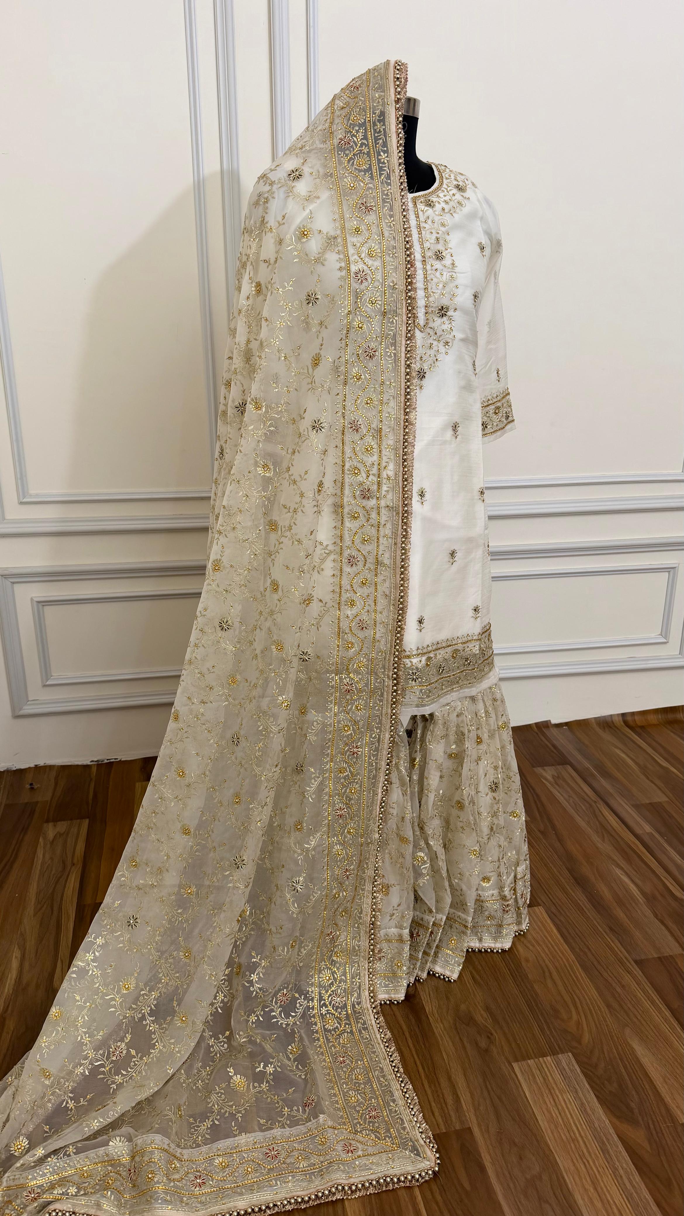 OFF WHITE EMBROERDED GHARARA WITH HAND WORK TOUCH