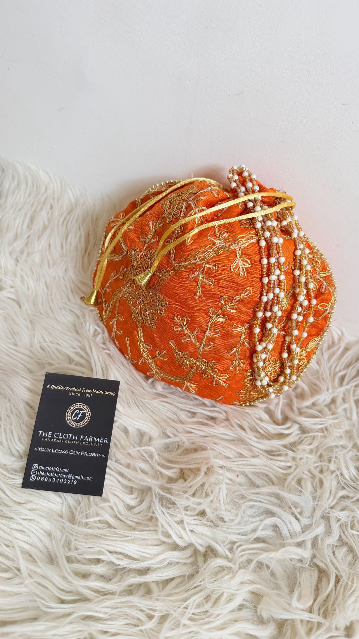 ORANGE COLOR BANARASI EMBROIDED POTLI